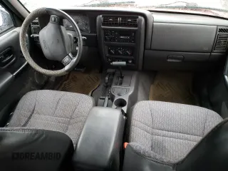 1999 Jeep Cherokee SE with VIN 1J4FF28S9XL645291, listed as a Copart auction lot 87064124 with Not provided miles and Salvage title. Bid and sale history available at DreamBid. Image 8.