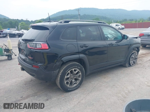 2021 Jeep Cherokee Trailhawk with VIN 1C4PJMBX0MD167941, listed as a IAAI auction lot 42507379 with 70,414 mi miles and . Bid and sale history available at DreamBid. Image 4.