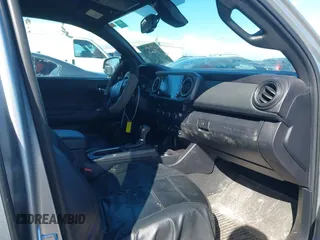 2022 Toyota Tacoma SR5 with VIN 3TMDZ5BN6NM122590, listed as a IAAI auction lot 41714578 with 56,472 mi miles and . Bid and sale history available at DreamBid. Image 5.