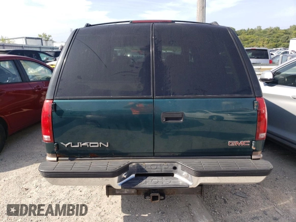 1998 GMC Yukon with VIN 1GKEK13RXWJ723572, listed as a Copart auction lot 65987314 with 237,503 mi miles and Salvage Title. Bid and sale history available at carsss.com. Image 6.
