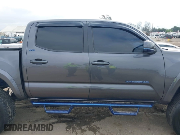 2018 Toyota Tacoma SR5 with VIN 5TFAZ5CNXJX066952, listed as a IAAI auction lot 41894562 with 141,818 mi miles and . Bid and sale history available at DreamBid. Image 13.