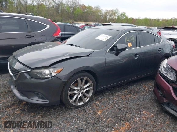 2014 Mazda 6 i Grand Touring with VIN JM1GJ1W50E1107877, listed as a IAAI auction lot 41857596 with 166,188 mi miles and . Bid and sale history available at DreamBid. Image 2.