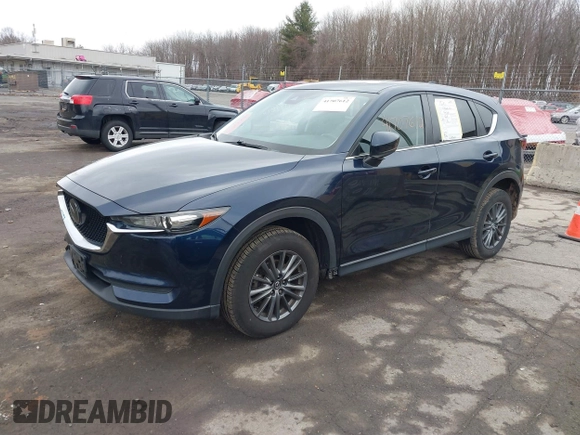 2021 Mazda CX-5 Touring with VIN JM3KFBCM7M1380396, listed as a IAAI auction lot 41707612 with 55,555 mi miles. Bid and sale history available at carsss.com. Image 2.
