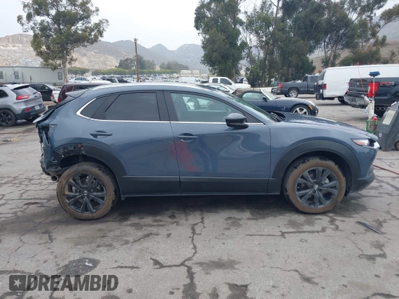 2022 Mazda CX-30 S Carbon Edition with VIN 3MVDMBCL0NM456154, listed as a IAAI auction lot 42153202 with 40,372 mi miles and . Bid and sale history available at DreamBid. Image 13.