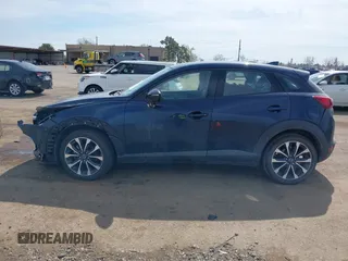 2019 Mazda CX-3 Touring z VIN JM1DKFC78K1416219, wystawiony jako IAAI lot #41761329 z przebiegiem 52 172 mil mil oraz . Historia ofert i sprzedaży dostępna na DreamBid. Obrazek 14.