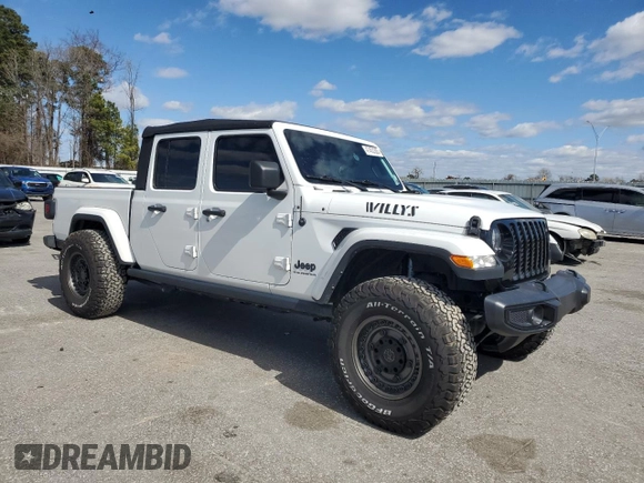 2023 Jeep Gladiator Sport S with VIN 1C6HJTAG4PL556387, listed as a Copart auction lot 47453305 with 35,611 mi miles and Salvage title. Bid and sale history available at DreamBid. Image 4.