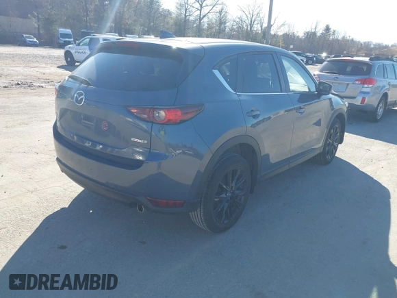 2021 Mazda CX-5 Touring with VIN JM3KFBCM0M0489644, listed as a IAAI auction lot 41756117 with 67,365 mi miles. Bid and sale history available at carsss.com. Image 4.