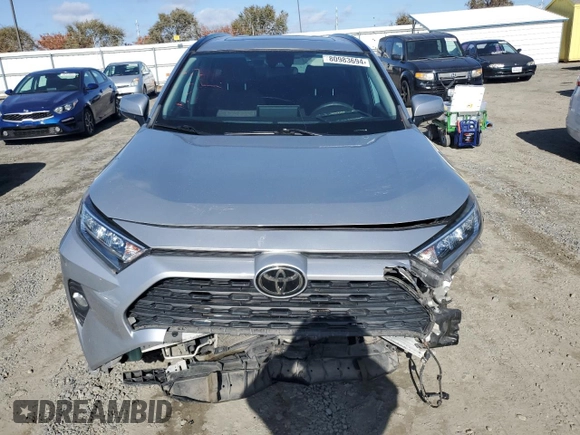 2019 Toyota RAV4 XLE with VIN 2T3W1RFV0KW036705, listed as a Copart auction lot 80983694 with 110,823 mi miles and Salvage Title. Bid and sale history available at carsss.com. Image 5.