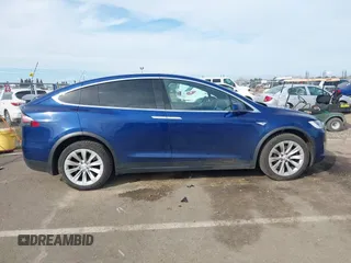 2016 Tesla Model X 70D z VIN 5YJXCAE29GF015890, wystawiony jako IAAI lot #41637564 z przebiegiem 145 848 mil mil oraz . Historia ofert i sprzedaży dostępna na DreamBid. Obrazek 13.