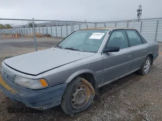 1990 Toyota Camry DLX z VIN 4T1SV21EXLU271320, wystawiony jako IAAI lot #41798353 z przebiegiem 269 178 mil mil oraz . Historia ofert i sprzedaży dostępna na DreamBid. Obrazek 2.