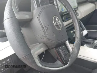 2022 Toyota Tundra Capstone Hybrid with VIN 5TFVC5DB4NX011801, listed as a IAAI auction lot 40218851 with 43,736 mi miles and . Bid and sale history available at DreamBid. Image 14.