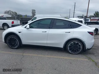2023 Tesla Model Y Long Range with VIN 7SAYGDEE7PA023295, listed as a IAAI auction lot 41773783 with 28,079 mi miles. Bid and sale history available at carsss.com. Image 14.