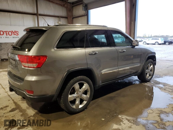 2013 Jeep Grand Cherokee Overland with VIN 1C4RJFCT5DC599866, listed as a Copart auction lot 51837395 with 105,521 mi miles and Salvage Title. Bid and sale history available at carsss.com. Image 3.
