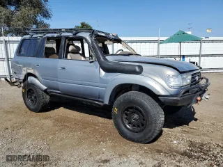 1996 Toyota Land Cruiser with VIN JT3HJ85J0T0145838, listed as a Copart auction lot 77593764 with 158,507 mi miles and Salvage Title. Bid and sale history available at carsss.com. Image 4.