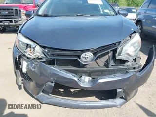 2016 Toyota Corolla L with VIN 5YFBURHE3GP564887, listed as a IAAI auction lot 42390190 with 97,642 mi miles and . Bid and sale history available at DreamBid. Image 6.