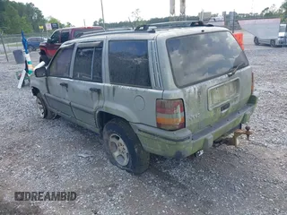 1995 Jeep Grand Cherokee Laredo with VIN 1J4GZ58S6SC756256, listed as a IAAI auction lot 42169534 with 255,516 mi miles. Bid and sale history available at carsss.com. Image 3.