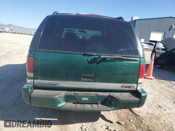 2000 GMC Jimmy SLE Convenience z VIN 1GKDT13W3Y2215035, wystawiony jako Copart lot #77484104 z przebiegiem 116 124 mil mil oraz Szkoda całkowita • Salvage title. Historia ofert i sprzedaży dostępna na DreamBid. Obrazek 6.