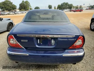 2004 Jaguar XJ with VIN SAJWA71C34SG19800, listed as a Copart auction lot 71877194 with 157,051 mi miles and Salvage Title. Bid and sale history available at carsss.com. Image 6.