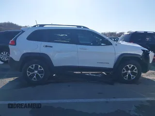 2018 Jeep Cherokee Trailhawk with VIN 1C4PJMBX7JD550173, listed as a IAAI auction lot 41094306 with 74,128 mi miles. Bid and sale history available at carsss.com. Image 13.