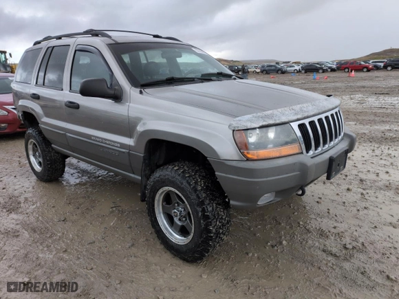 1999 Jeep Grand Cherokee Laredo with VIN 1J4GW58SXXC553547, listed as a Copart auction lot 50786405 with 151,968 mi miles and Salvage Title. Bid and sale history available at carsss.com. Image 4.