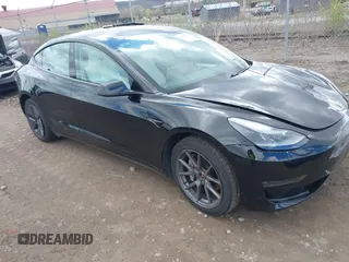 2021 Tesla Model 3 Long Range with VIN 5YJ3E1EB7MF052988, listed as a IAAI auction lot 42052662 with 29,877 mi miles and . Bid and sale history available at carsss.com. Image 1.