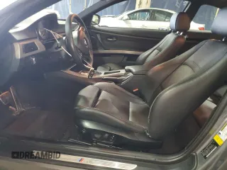2011 BMW 3 Series 335is with VIN WBAKG1C56BE599457, listed as a Copart auction lot 52412655 with 134,497 mi miles and Clean title. Bid and sale history available at DreamBid. Image 7.
