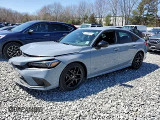 2022 Honda Civic Sport z VIN 2HGFE2F50NH579599, wystawiony jako Copart lot #52400205 z przebiegiem Nie podano mil oraz Szkoda całkowita • Salvage title. Historia ofert i sprzedaży dostępna na DreamBid. Obrazek 1.