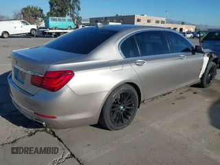 2015 BMW 7 Series 750Li with VIN WBAYE8C55FD782384, listed as a IAAI auction lot 41319363 with 75,784 mi miles. Bid and sale history available at carsss.com. Image 4.