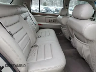 1995 Cadillac DeVille z VIN 1G6KD52B8SU274053, wystawiony jako Copart lot #86429934 z przebiegiem 100 496 mil mil oraz Szkoda całkowita • Salvage title. Historia ofert i sprzedaży dostępna na DreamBid. Obrazek 10.