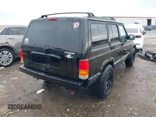 1999 Jeep Cherokee Sport with VIN 1J4FT68S6XL598558, listed as a IAAI auction lot 41549504 with 238,004 mi miles. Bid and sale history available at carsss.com. Image 4.