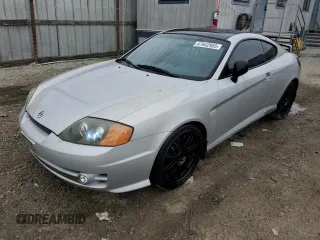2003 Hyundai Tiburon GT z VIN KMHHN65F03U079618, wystawiony jako Copart lot #47642965 z przebiegiem 87 483 mil mil oraz Czysty tytuł • Clean title. Historia ofert i sprzedaży dostępna na DreamBid. Obrazek 1.