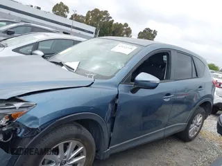 2016 Mazda CX-5 Touring z VIN JM3KE2CY2G0699138, wystawiony jako IAAI lot #42153228 z przebiegiem 144 191 mil mil oraz . Historia ofert i sprzedaży dostępna na DreamBid. Obrazek 14.