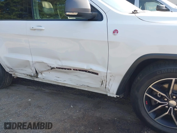 2017 Jeep Grand Cherokee Trailhawk with VIN 1C4RJFLG2HC670868, listed as a IAAI auction lot 42711041 with 129,465 mi miles and . Bid and sale history available at DreamBid. Image 6.
