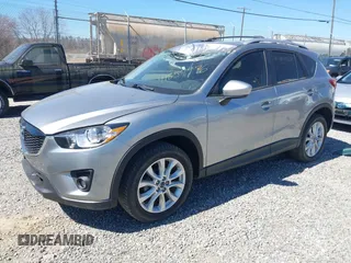 2014 Mazda CX-5 Grand Touring with VIN JM3KE4DY3E0368169, listed as a IAAI auction lot 41857976 with 127,853 mi miles. Bid and sale history available at carsss.com. Image 2.