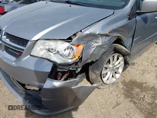 2014 Dodge Grand Caravan SXT with VIN 2C4RDGCG4ER106106, listed as a IAAI auction lot 41830512 with 135,044 mi miles and . Bid and sale history available at DreamBid. Image 6.