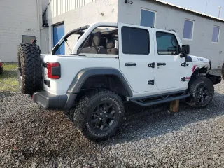 2021 Jeep Wrangler Unlimited 80th Anniversary z VIN 1C4HJXDG4MW794519, wystawiony jako Copart lot #60116105 z przebiegiem 25 708 mil mil oraz Szkoda całkowita • Salvage title. Historia ofert i sprzedaży dostępna na DreamBid. Obrazek 3.