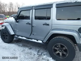 2015 Jeep Wrangler Unlimited Rubicon Hard Rock with VIN 1C4HJWFG1FL659803, listed as a IAAI auction lot 41172485 with 126,881 mi miles. Bid and sale history available at carsss.com. Image 14.