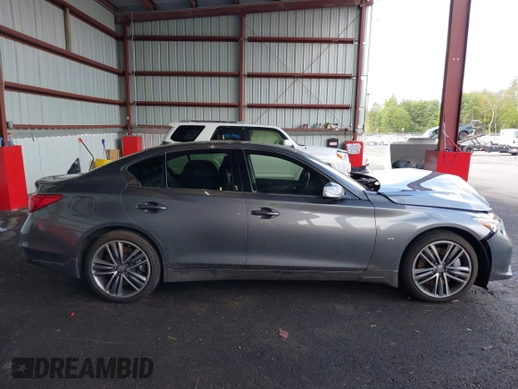 2015 Infiniti Q50 Premium z VIN JN1BV7AR3FM422042, wystawiony jako IAAI lot #42258784 z przebiegiem 72 030 mil mil oraz . Historia ofert i sprzedaży dostępna na DreamBid. Obrazek 13.