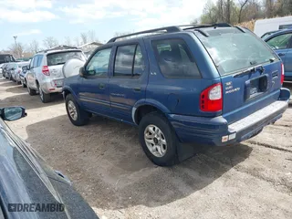 2002 Isuzu Rodeo S with VIN 4S2CK58W124320988, listed as a IAAI auction lot 41921874 with 227,320 mi miles. Bid and sale history available at carsss.com. Image 3.