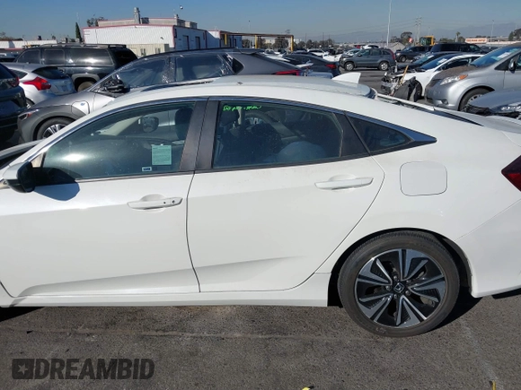 2017 Honda Civic EX-T with VIN 19XFC1E38HE002205, listed as a IAAI auction lot 40891678 with 10,398 mi miles and . Bid and sale history available at DreamBid. Image 14.