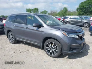 2021 Honda Pilot Touring 8-Passenger with VIN 5FNYF6H95MB075033, listed as a IAAI auction lot 42501452 with 35,618 mi miles and . Bid and sale history available at DreamBid. Image 1.