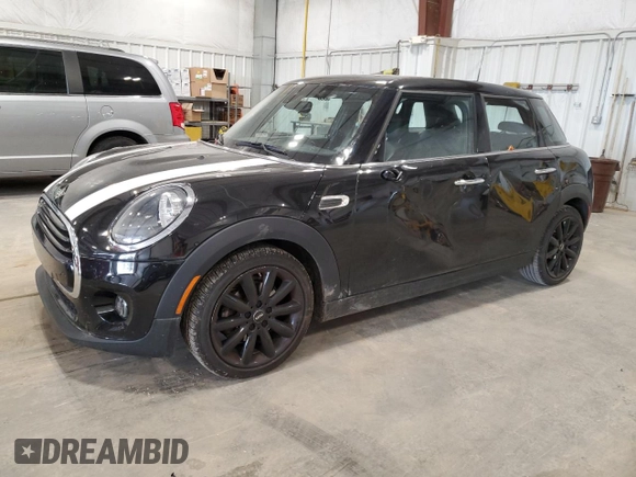 2021 MINI Hardtop 4 Door Oxford Edition with VIN WMWXU7C00M2N49230, listed as a Copart auction lot 77797914 with 51,877 mi miles and Salvage title. Bid and sale history available at DreamBid. Image 1.