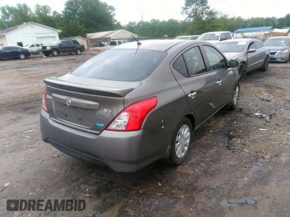 2015 Nissan Versa SV with VIN 3N1CN7AP7FL869485, listed as a IAAI auction lot 42077524 with 198,646 mi miles. Bid and sale history available at carsss.com. Image 4.
