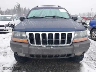 2001 Jeep Grand Cherokee Laredo with VIN 1J4GW48N21C730703, listed as a IAAI auction lot 41581667 with 111,054 mi miles. Bid and sale history available at carsss.com. Image 13.