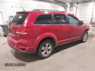 2012 Dodge Journey SXT z VIN 3C4PDDBG4CT397806, wystawiony jako IAAI lot #41333394 z przebiegiem 122 804 mil mil oraz . Historia ofert i sprzedaży dostępna na DreamBid. Obrazek 4.