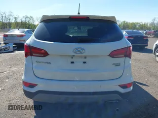 2018 Hyundai Santa Fe 2.4L z VIN 5NMZTDLB3JH090748, wystawiony jako IAAI lot #42145245 z przebiegiem 112 314 mil mil oraz . Historia ofert i sprzedaży dostępna na DreamBid. Obrazek 17.