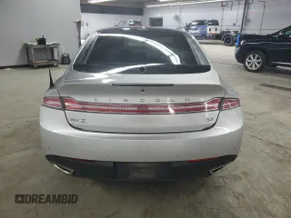2013 Lincoln MKZ z VIN 3LN6L2GK8DR803824, wystawiony jako Copart lot #58899065 z przebiegiem 136 762 mil mil oraz Tytuł czysty. Historia ofert i sprzedaży dostępna na DreamBid. Obrazek 6.
