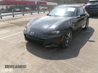 2021 Mazda MX-5 Miata Grand Touring z VIN JM1NDAM75M0451597, wystawiony jako IAAI lot #41932712 z przebiegiem 61 710 mil mil oraz . Historia ofert i sprzedaży dostępna na DreamBid. Obrazek 2.
