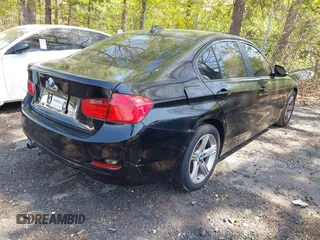 2014 BMW 3 Series 320i with VIN WBA3B1C56EK131849, listed as a IAAI auction lot 42018005 with 215,765 mi miles. Bid and sale history available at carsss.com. Image 4.