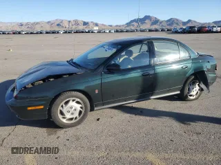 1996 Saturn SL with VIN 1G8ZK5272TZ137198, listed as a Copart auction lot 72446614 with 99,586 mi miles and Salvage Title. Bid and sale history available at carsss.com. Image 1.